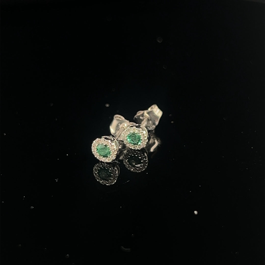 14 kt oorstekers Smaragd en Diamant