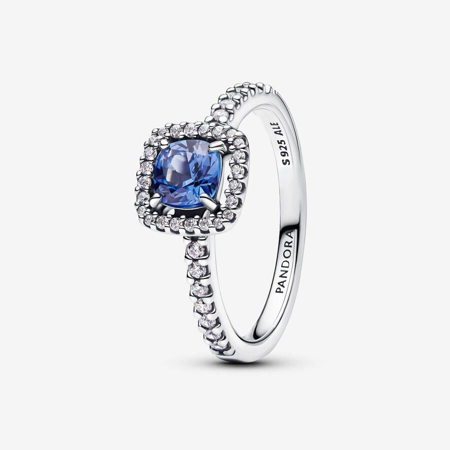 Sprankelende ring met vierkante blauwe halo