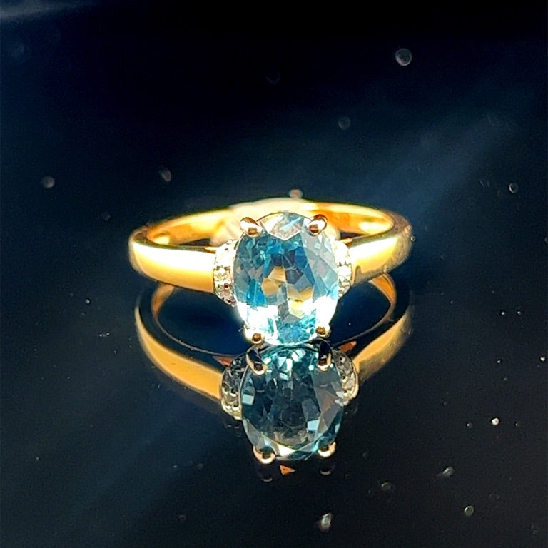 14k Geelgouden Ring met Sky Blue Topaas en Diamant