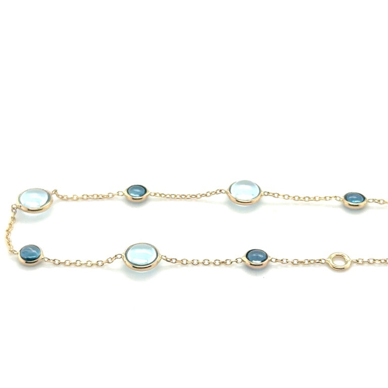 14 karaat geelgouden armband met Sky Blue en London Blue Topaas – 17-19 cm