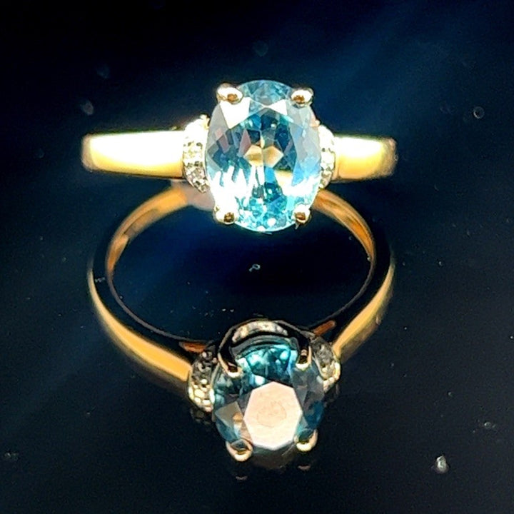 14k Geelgouden Ring met Sky Blue Topaas en Diamant