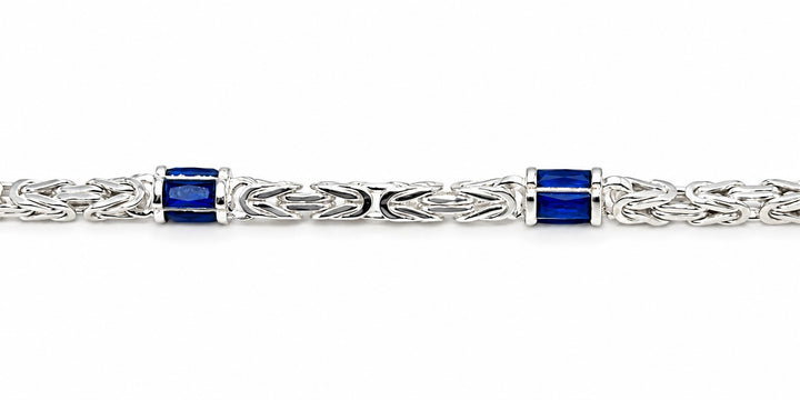 Zilveren Massieve Koningsschakel Armband 4 mm met Blauwe Zirkonia Baguette 19 cm
