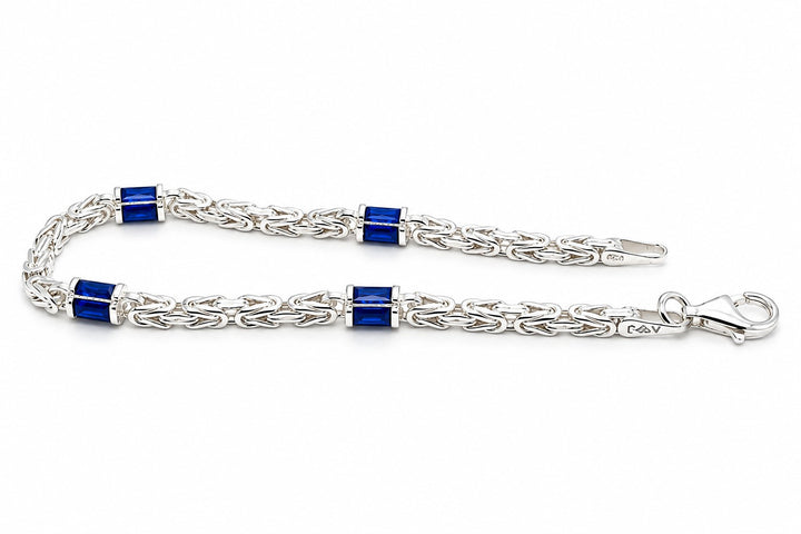 Zilveren Massieve Koningsschakel Armband 4 mm met Blauwe Zirkonia Baguette 19 cm