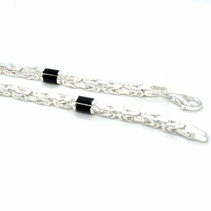 Zilveren Massieve Koningsschakel Armband 4 mm met Onyx – 22 cm