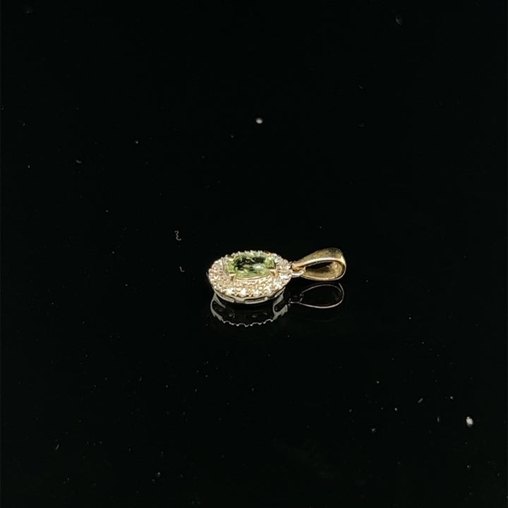 14 kt hanger smaragd en diamant 1.00 ct en 0.26 ct