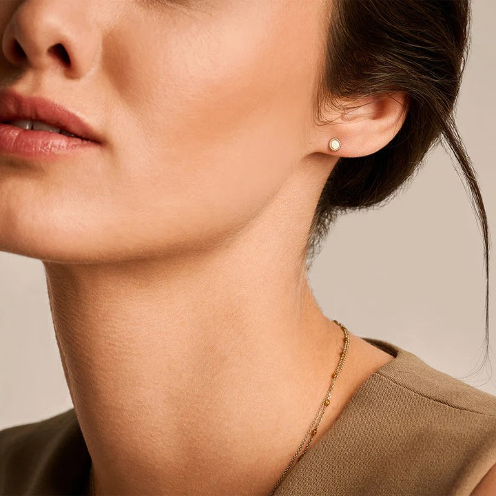 7350YGO Blush geelgouden oorknoppen rond met kabelrand