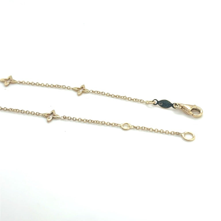 14 karaat geelgouden armband met 5 lelies 17 - 19 cm