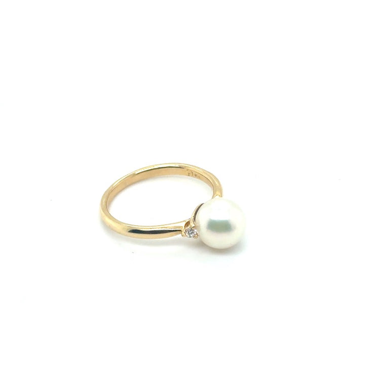 Occasion Parelring 18 kt met Diamant