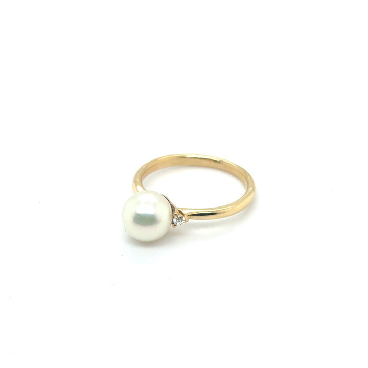 Occasion Parelring 18 kt met Diamant