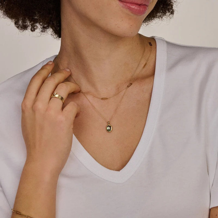 14k cliphanger met zwarte parelmoer en bergkristal